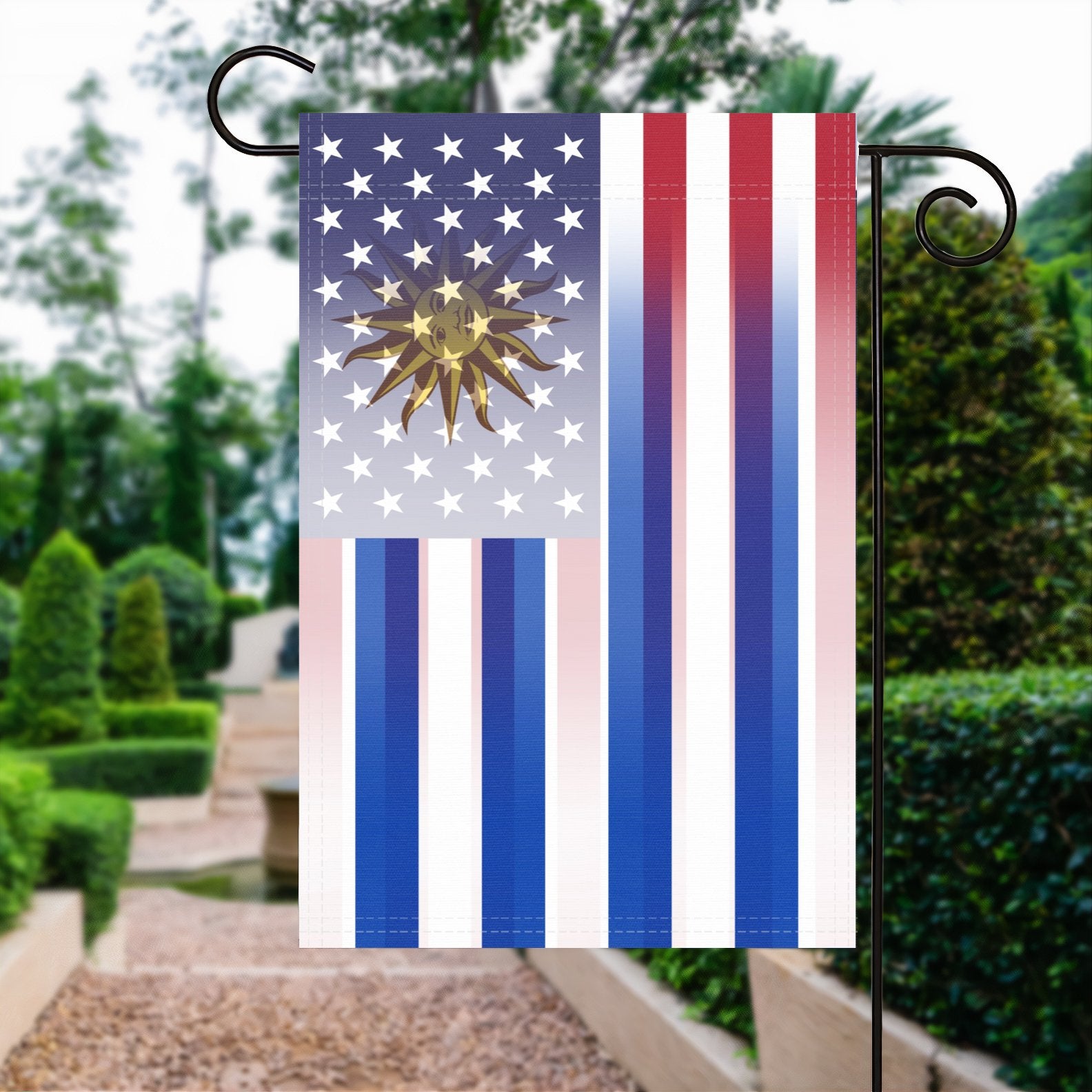 A garden flag with the Uruguayan American flag design seamlessly blended with the American flag, displayed in a garden.