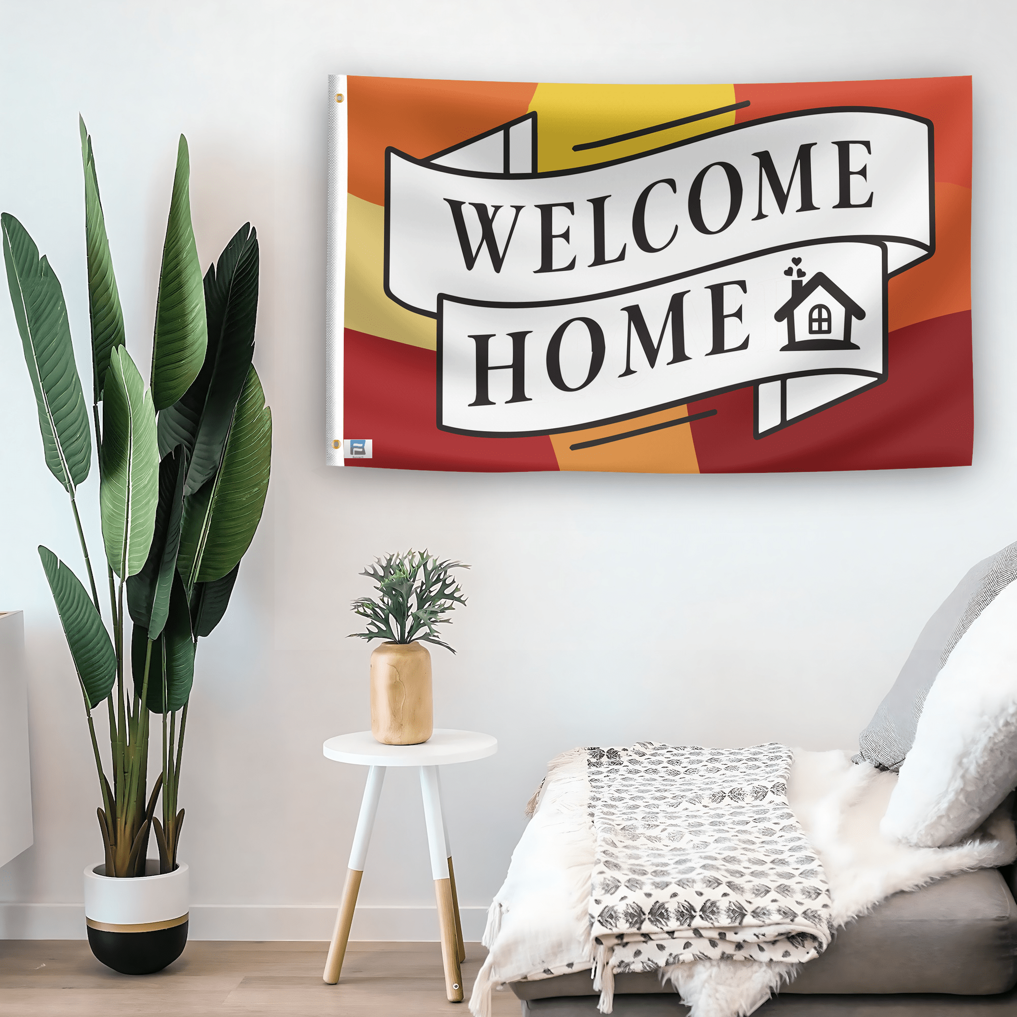 In a home setting, a flag with the saying "Welcome Home" is mounted on a white wall by a side table.