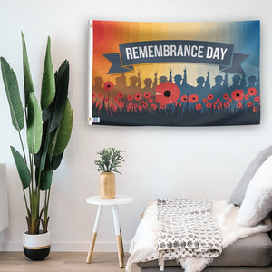 In a home setting, a flag with the saying "Remembrance Day" is mounted on a white wall by a side table.