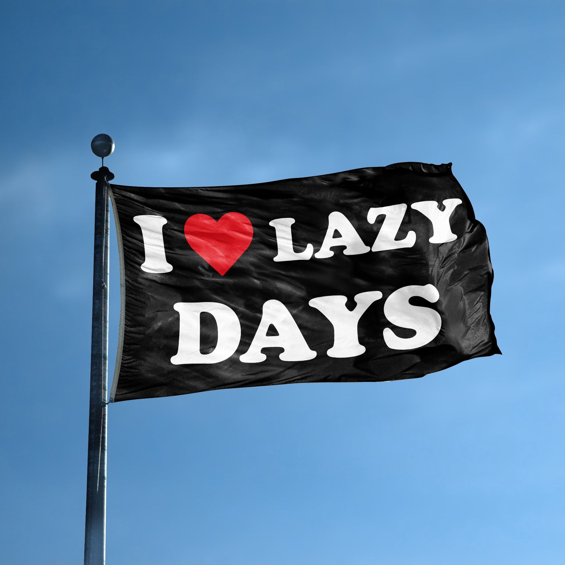 A flag with the saying "I Love Lazy Days" displayed on a high pole, with a black, white and red color scheme.