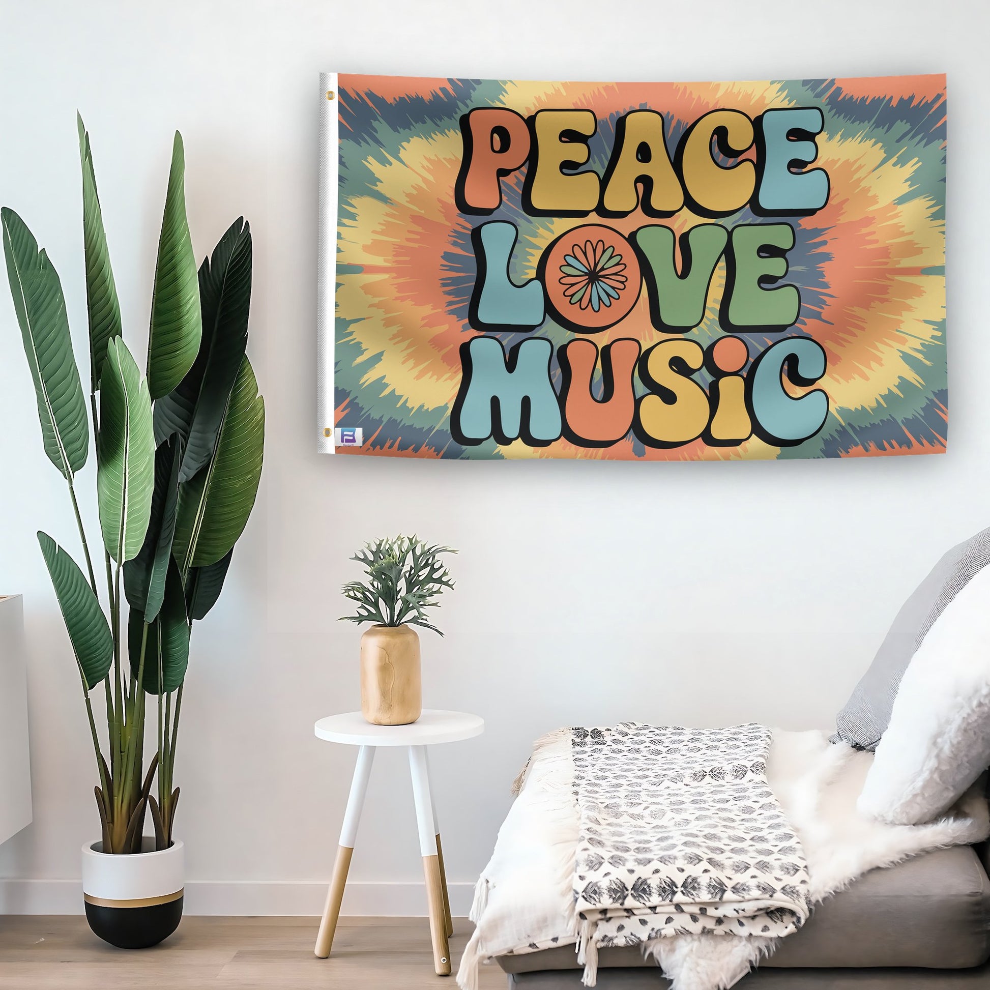 In a home setting, a flag with the saying "Peace Love Music" is mounted on a white wall by a side table.