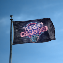 Load image into Gallery viewer, A flag with the saying &quot;Turbo Charged&quot; displayed on a high pole, with a neon style color scheme.
