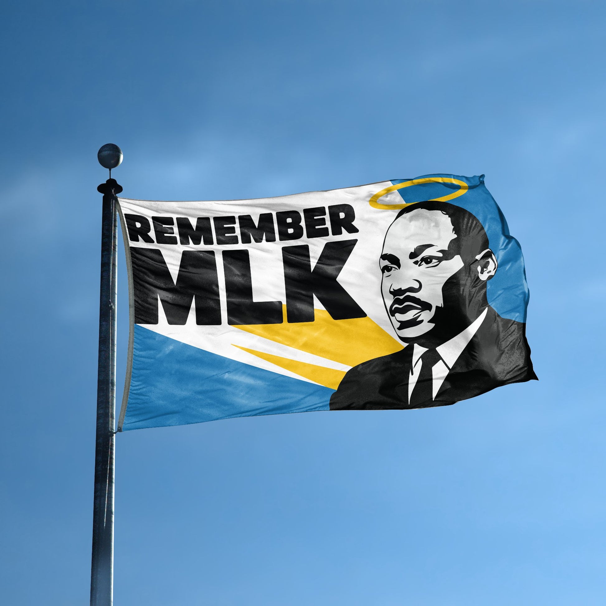 A flag with the saying "Remember MLK" displayed on a high pole, with a holiday themed color scheme.