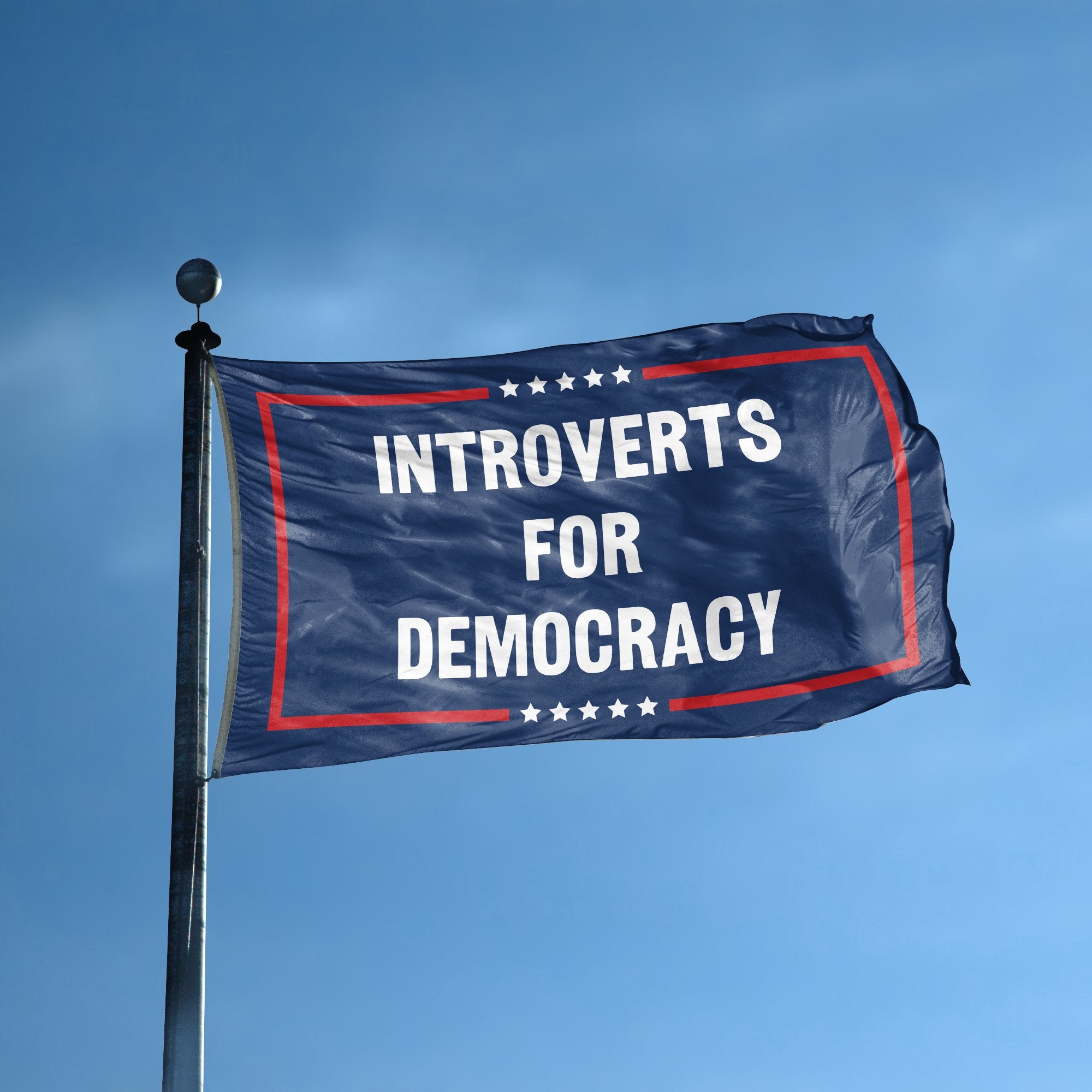 A flag with the saying "Introverts For Democracy Political" displayed on a high pole, with a red, white, and blue color scheme.