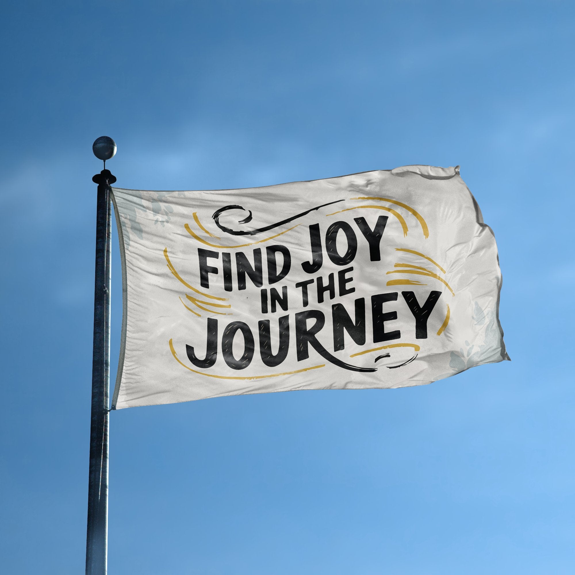 A flag with the saying "Find Joy In The Journey" displayed on a high pole, with a special occasion color scheme.