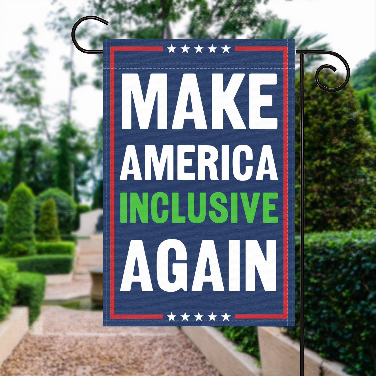 A red, white and blue political garden flag with the slogan Make America Inclusive Again.