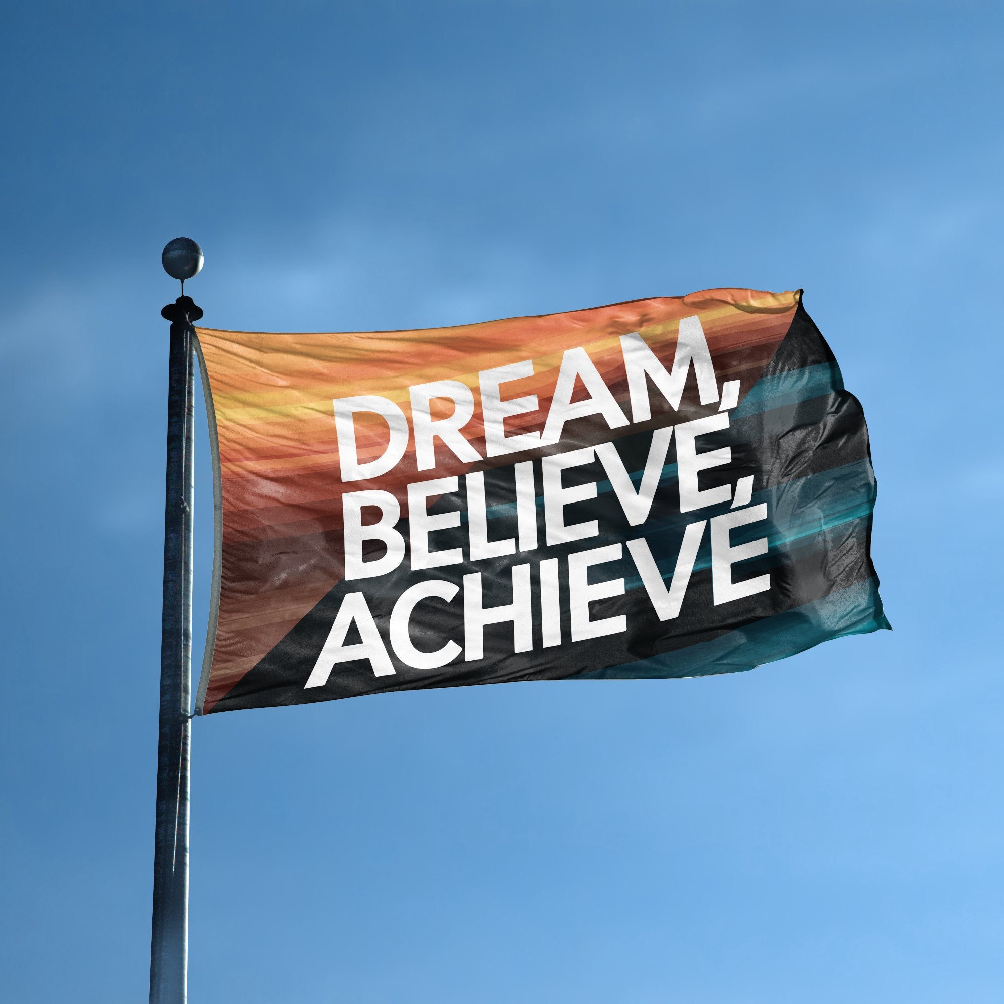 A flag with the saying "Dream Believe Achieve Motivational" displayed on a high pole, with a special occasion color scheme.