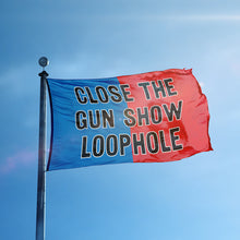 Load image into Gallery viewer, A flag containing a political slogan displayed on a high pole, featuring a patriotic red and blue background.
