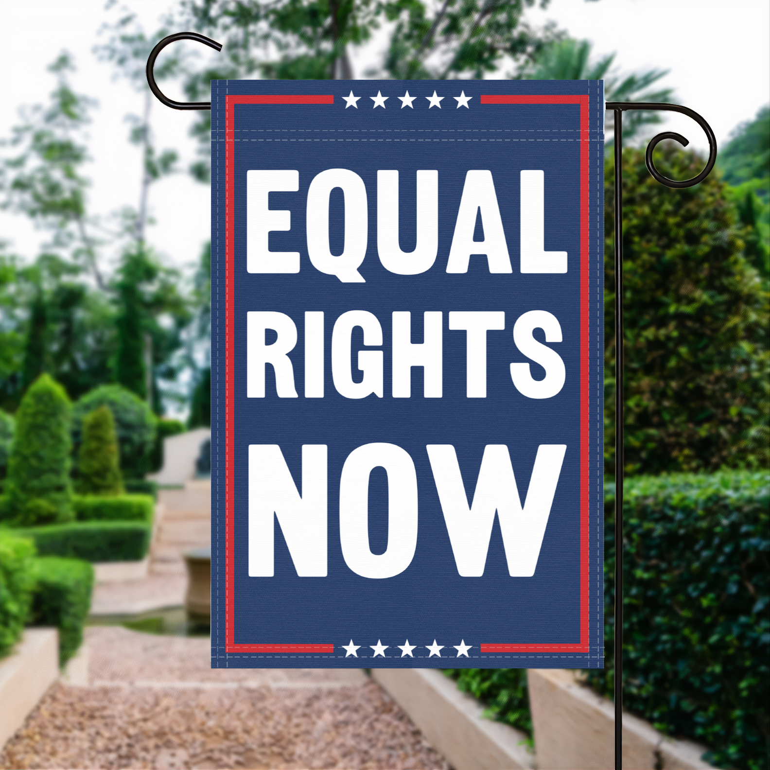 A red, white and blue political garden flag with the slogan Equal Rights Now.