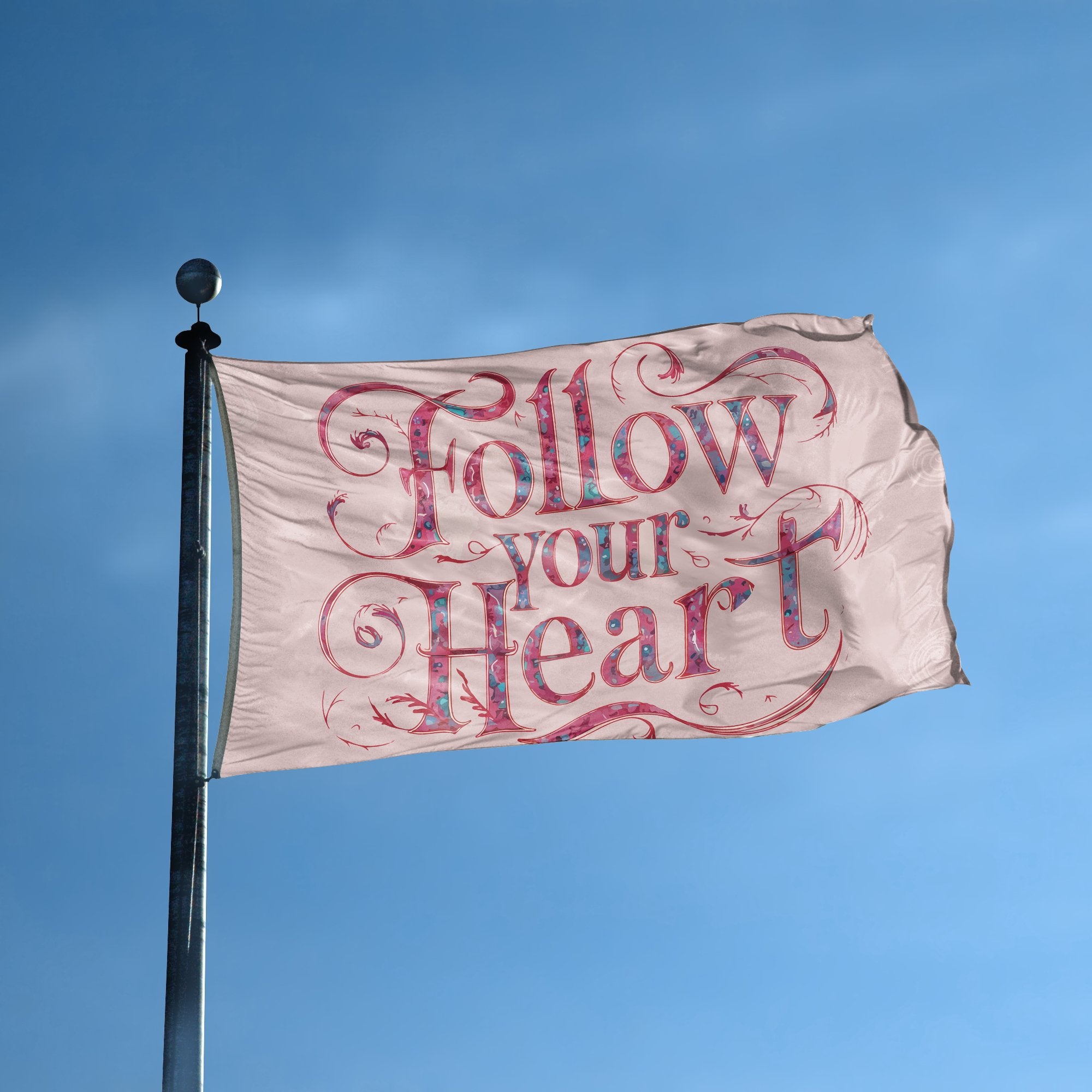 A flag with the saying "Follow Your Heart" displayed on a high pole, with a special occasion color scheme.