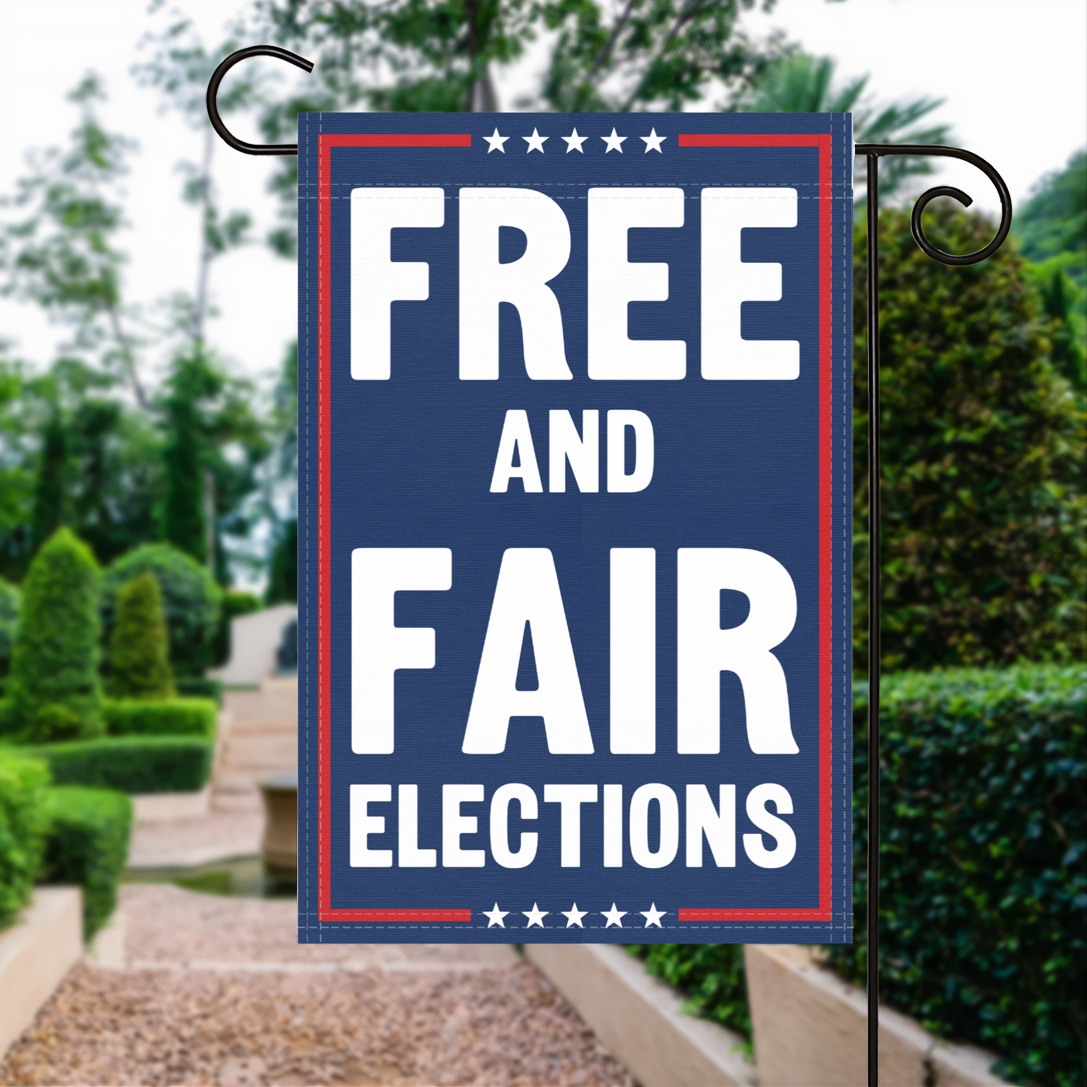 A red, white and blue political garden flag with the slogan Free And Fair Elections.