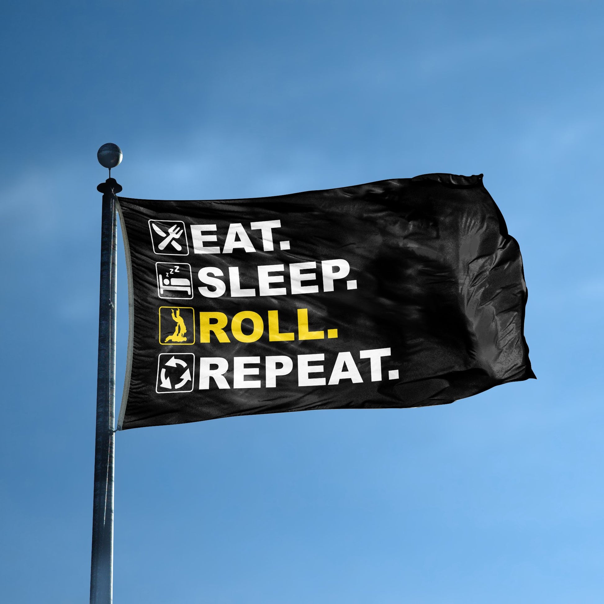 A flag with the saying "Eat Sleep Roll Repeat Jiujitsu" displayed on a high pole, with a black, white and themed color scheme.