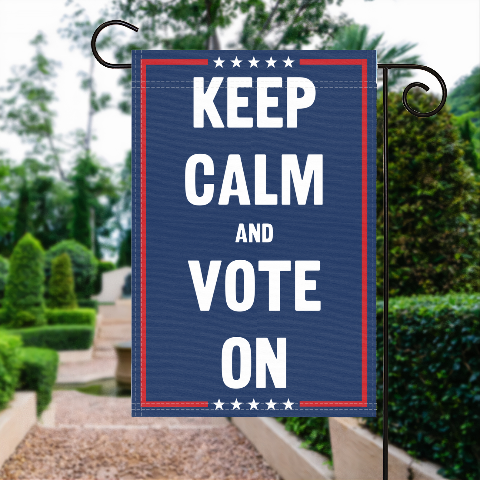 A red, white and blue political garden flag with the slogan Keep Calm And Vote On.