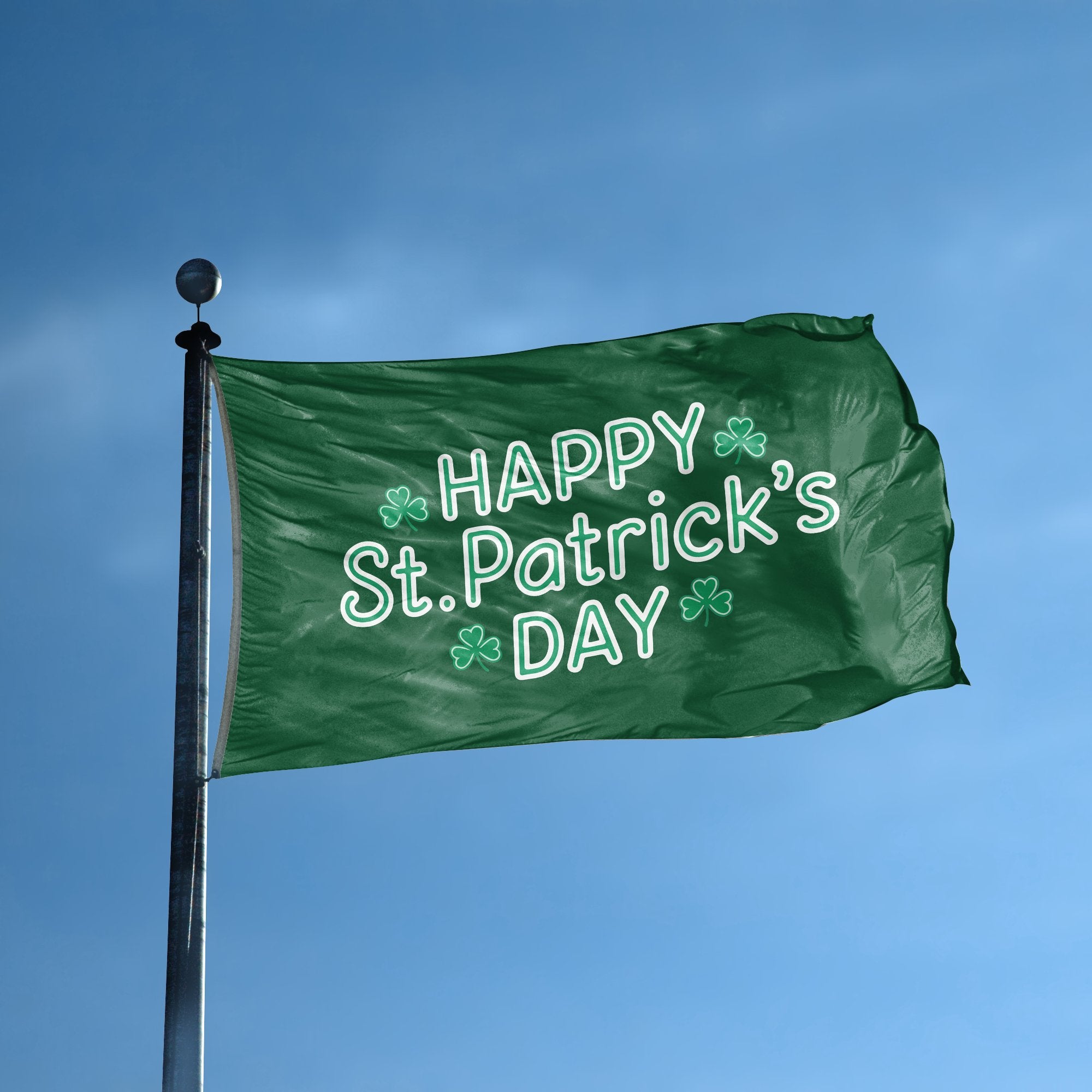 A flag with the saying "Happy St. Patrick's Day" displayed on a high pole, with a holiday themed color scheme.