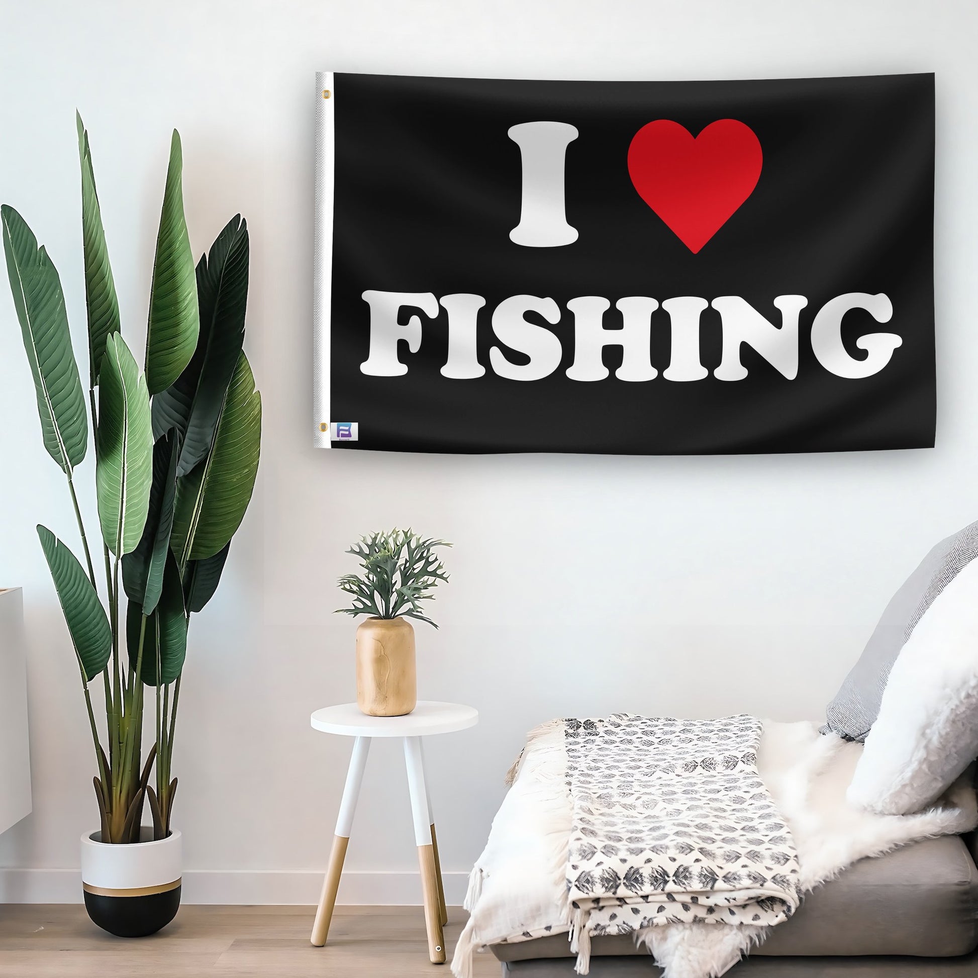 In a home setting, a flag with the saying "I Love Fishing" is mounted on a white wall by a side table.