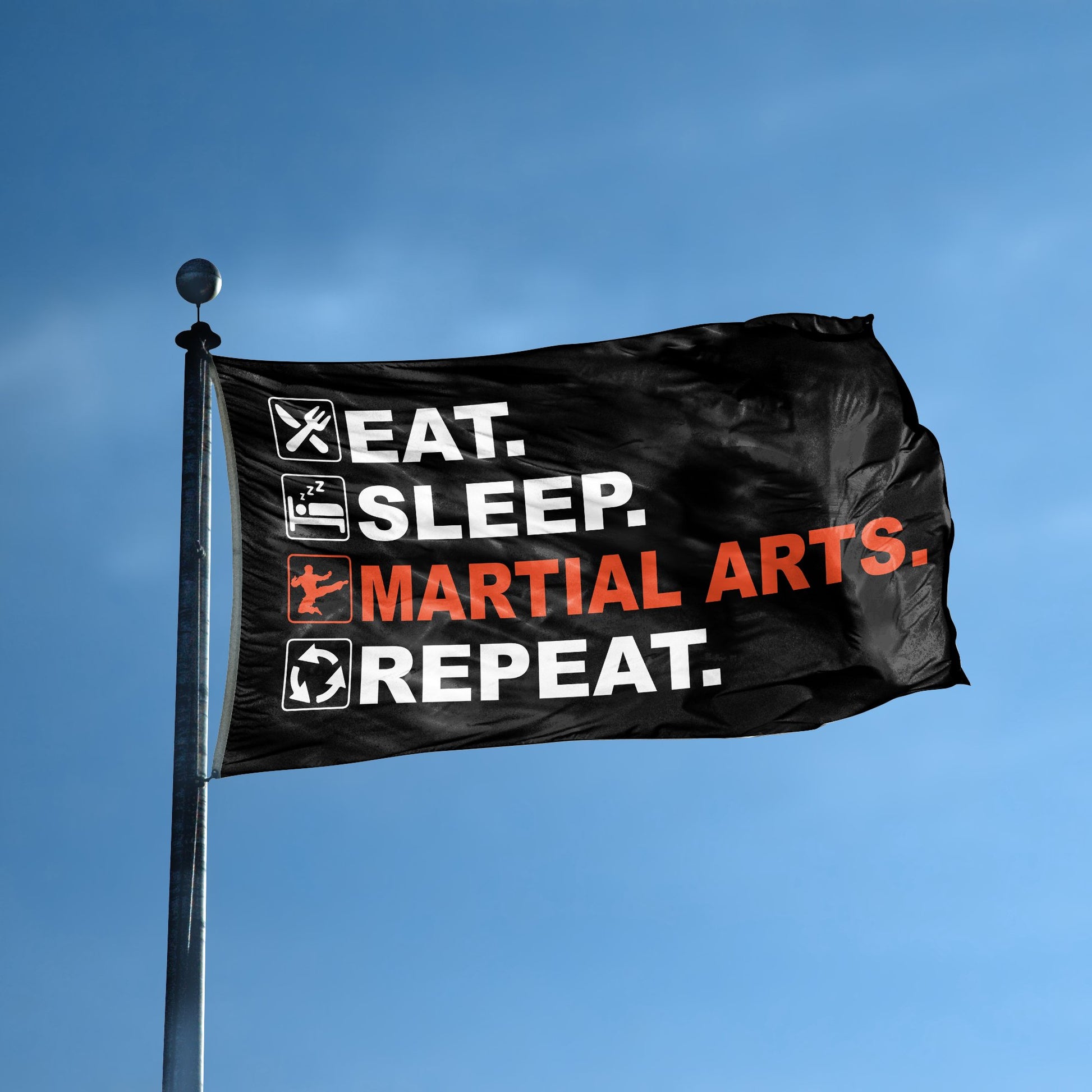 A flag with the saying "Eat Sleep Martial Arts Repeat" displayed on a high pole, with a black, white and themed color scheme.