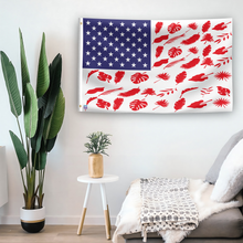 Load image into Gallery viewer, In a home setting, an american flag with the theme &quot;Tree Leaf Stripes American&quot; is mounted on a white wall by a side table.
