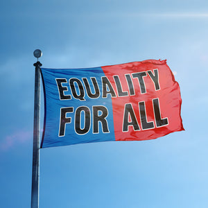 A flag containing a political slogan displayed on a high pole, featuring a patriotic red and blue background.