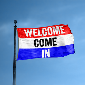 A business banner with the saying "Welcome Come In" displayed on a high pole, with a red, white, and blue color scheme.