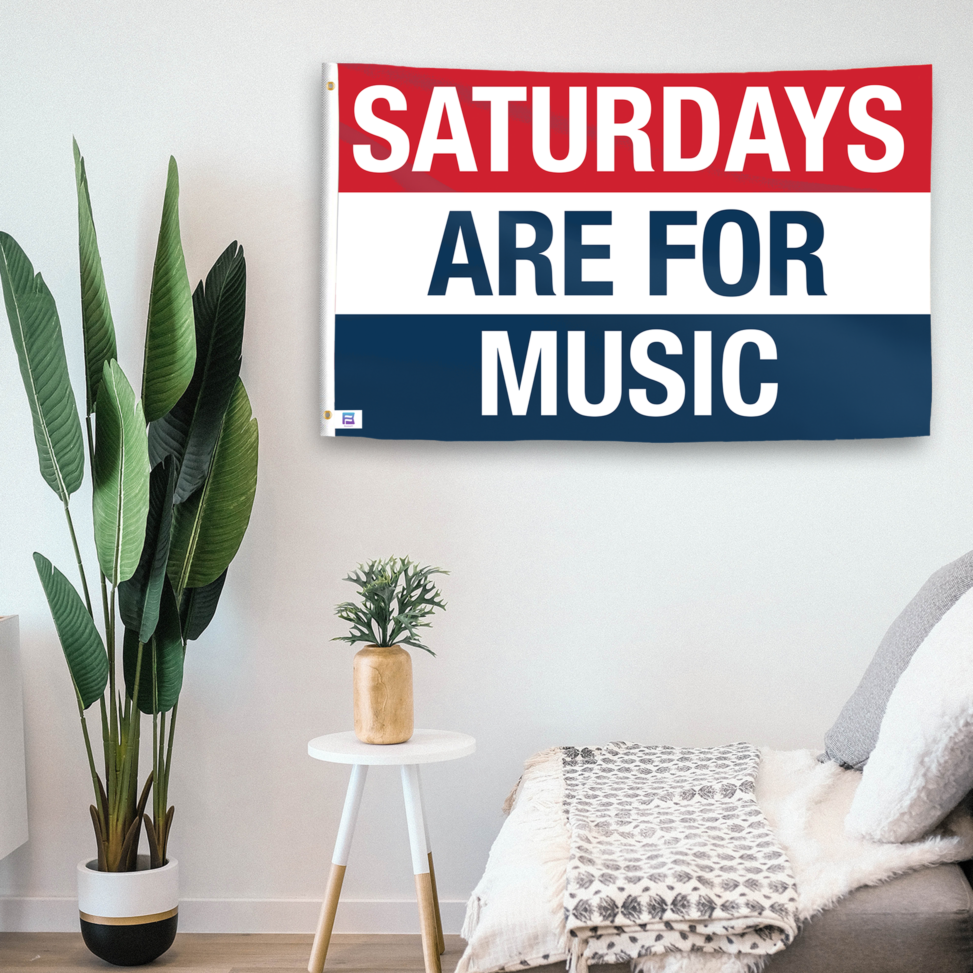 In a home setting, a flag with the saying "https://www.dropbox.com/scl/fi/wzqcdue1kmje1ot74qxep/saturdays-are-for-music_room.png?rlkey=55ch33eda0zddc8g7bnyq4dw3&raw=1" is mounted on a white wall by a side table.