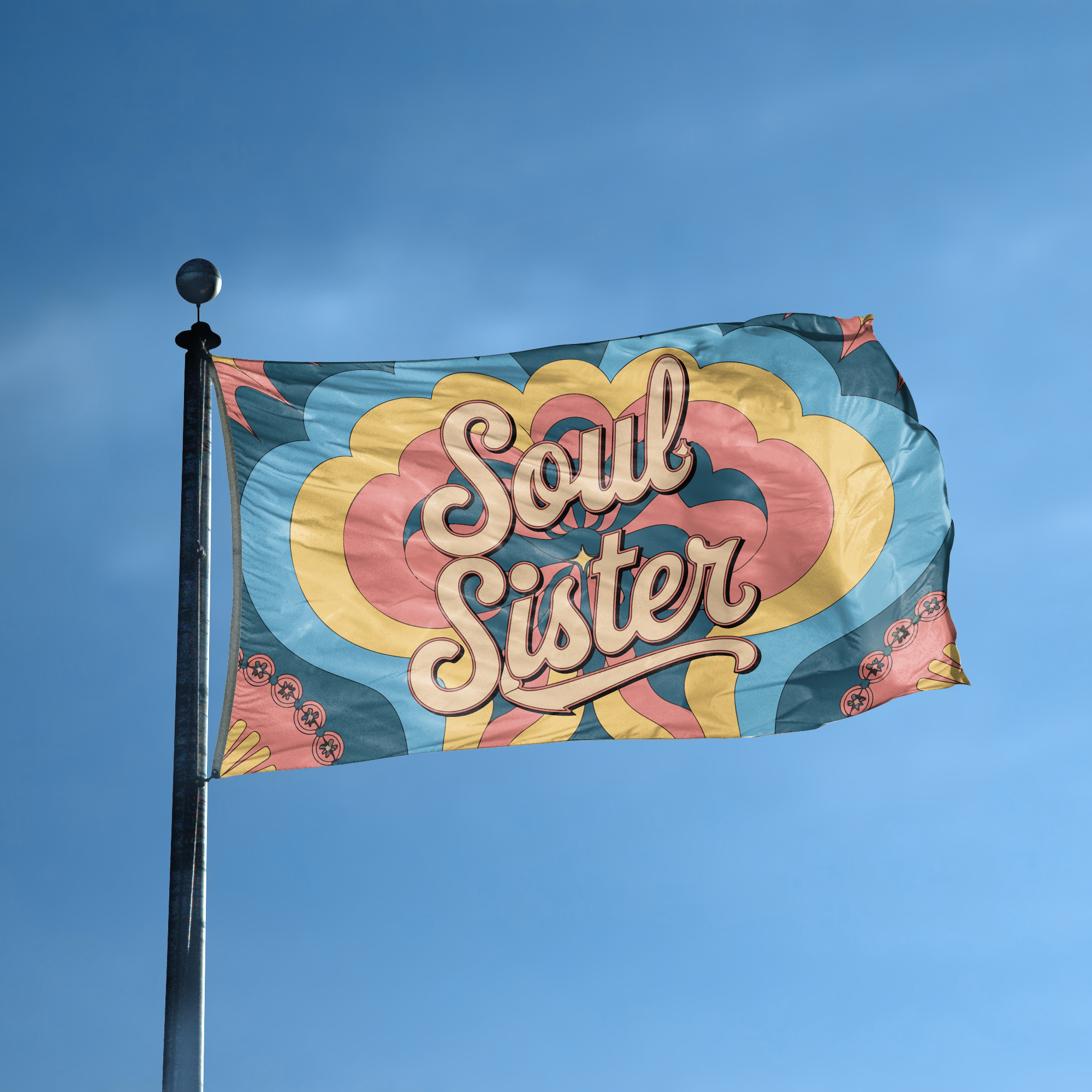 A flag with the saying "Soul Sister" displayed on a high pole, with a tie dye style color scheme.