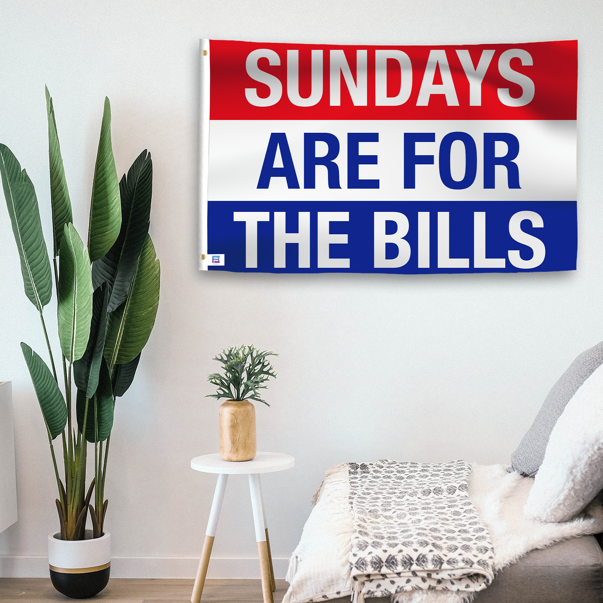 In a home setting, a flag with the saying "https://www.dropbox.com/scl/fi/ww9d33w1zuh0h2fepfvty/sundays-are-for-the-bills_room.png?rlkey=nysb2utfdj3iqjgubee2np4o3&raw=1" is mounted on a white wall by a side table.