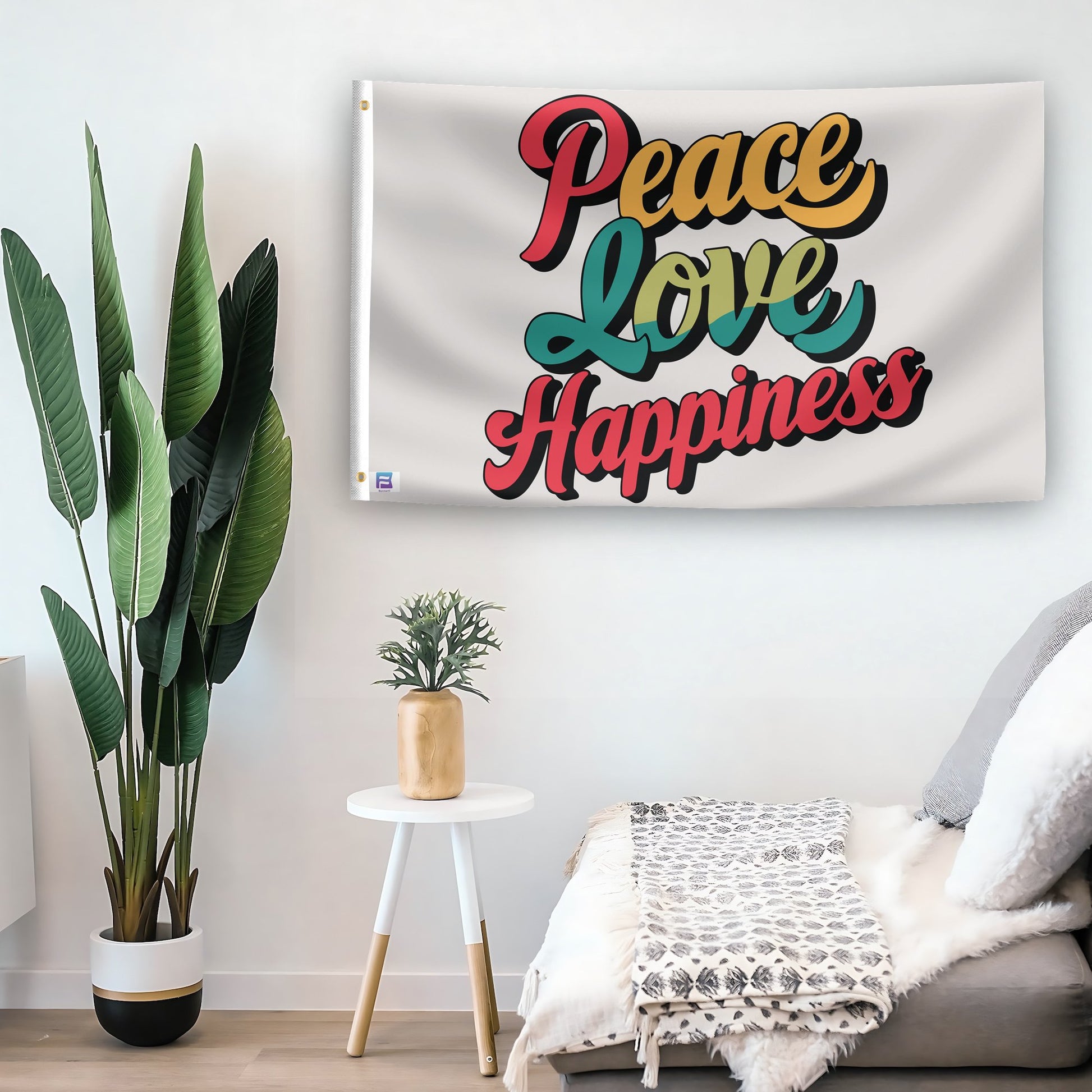 In a home setting, a flag with the saying "Peace Love Happiness" is mounted on a white wall by a side table.