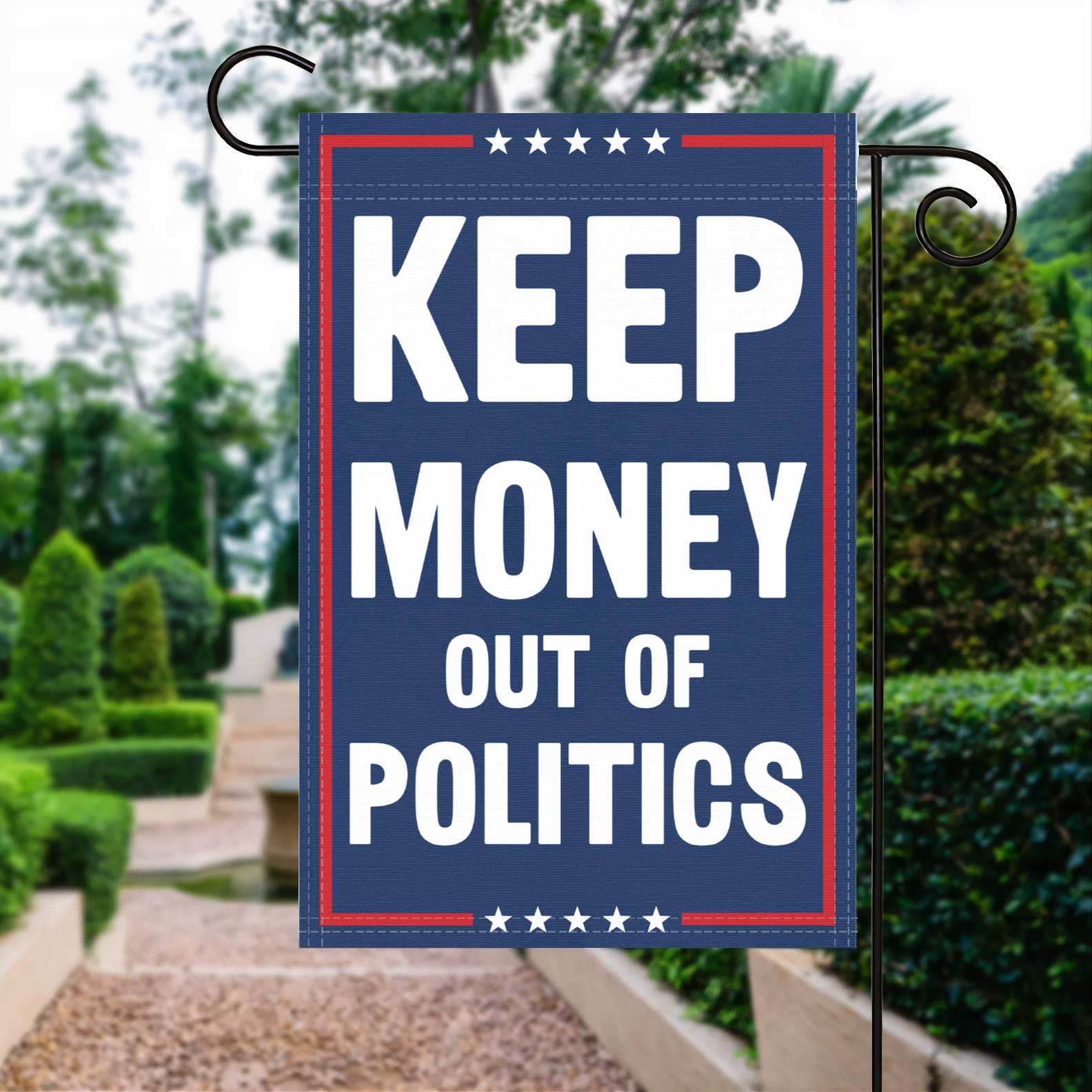 A red, white and blue political garden flag with the slogan Keep Money Out Of Politics.