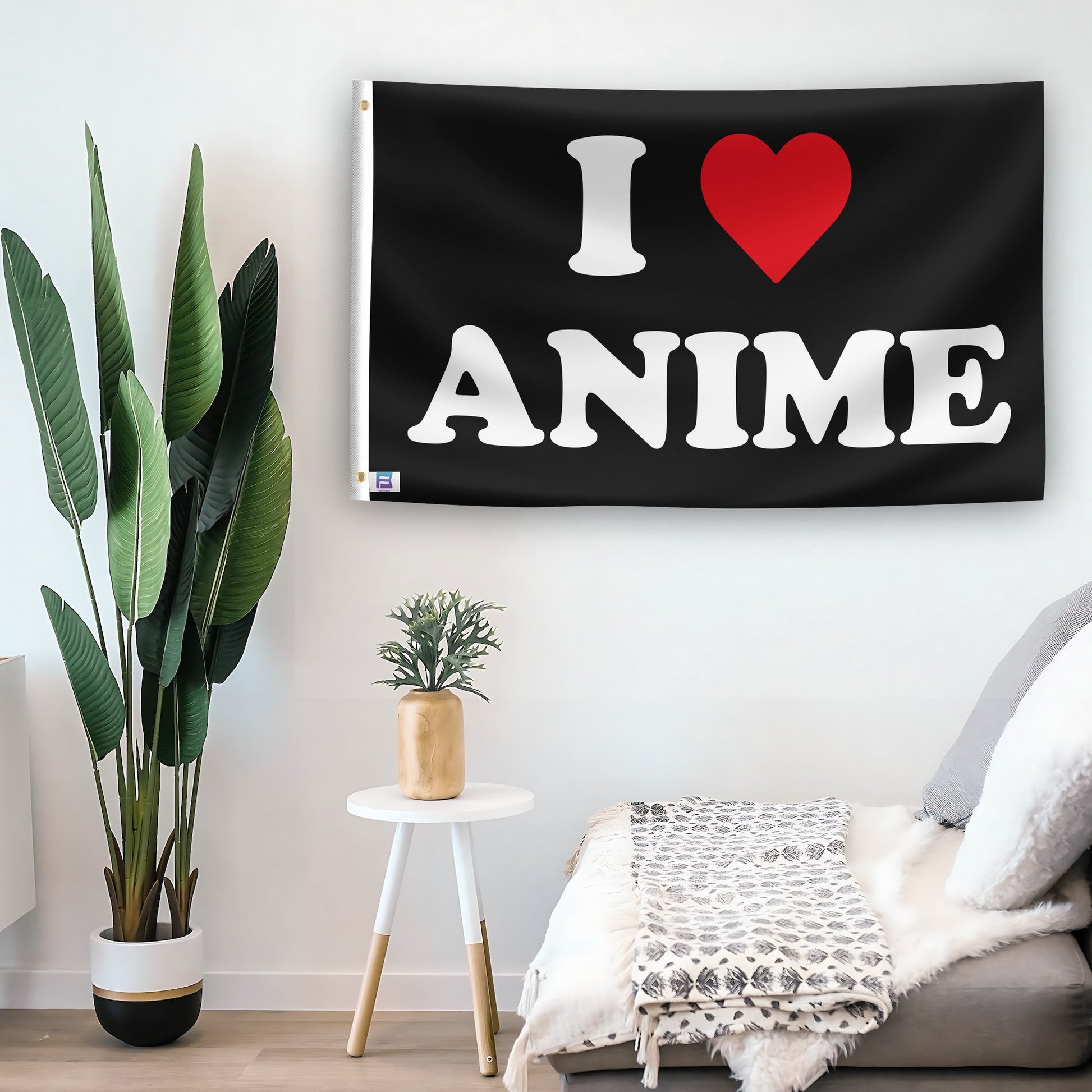 In a home setting, a flag with the saying "I Love Anime" is mounted on a white wall by a side table.