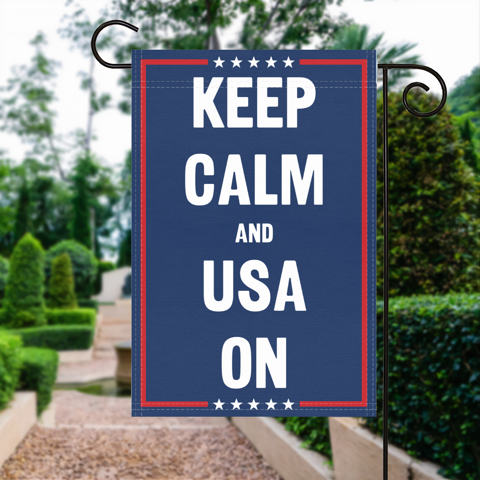 A red, white and blue political garden flag with the slogan Keep Calm And Usa On.