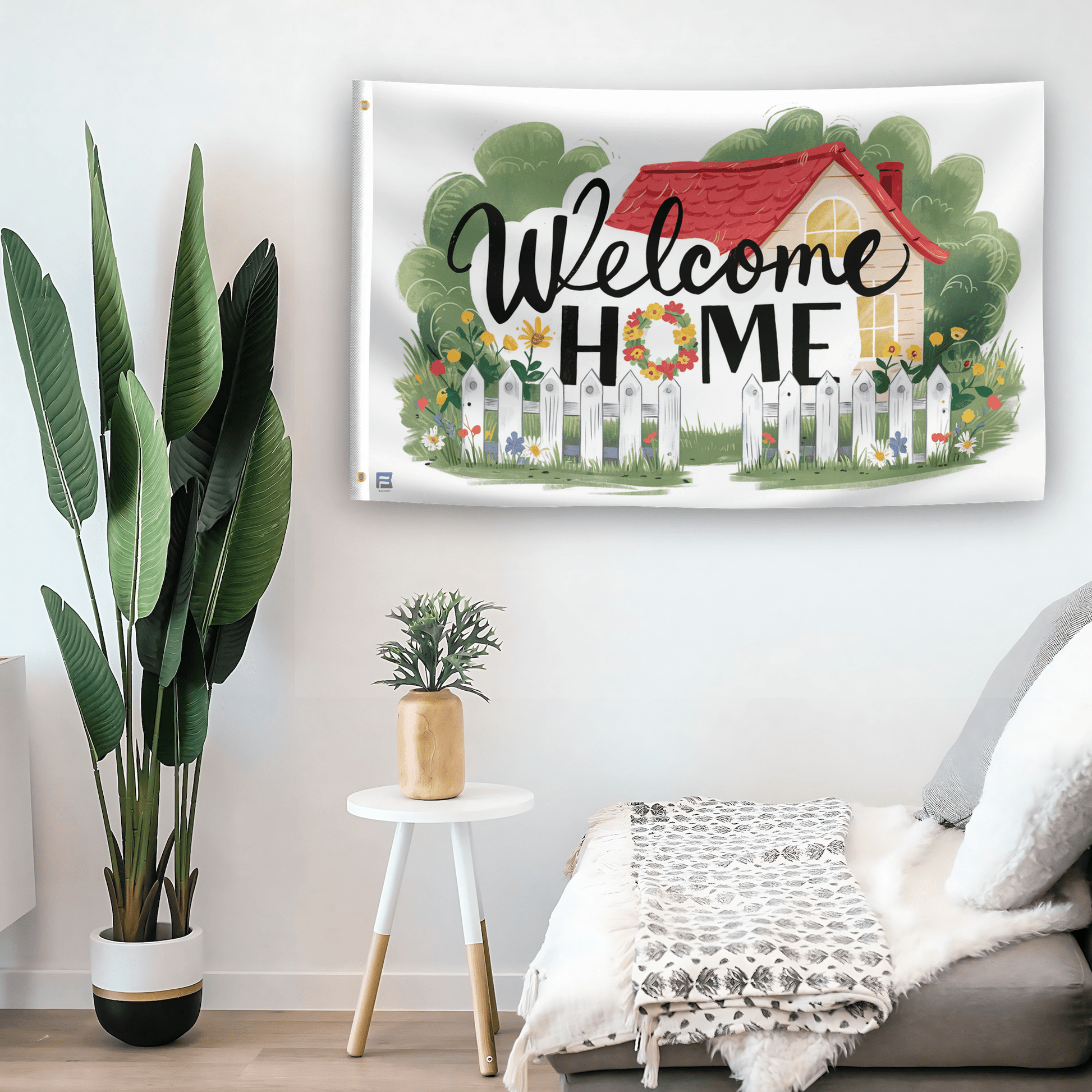 In a home setting, a flag with the saying "Welcome Home House" is mounted on a white wall by a side table.