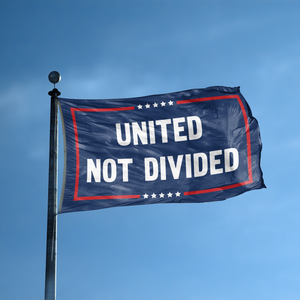 A flag with the saying "United Not Divided Political" displayed on a high pole, with a red, white, and blue color scheme.