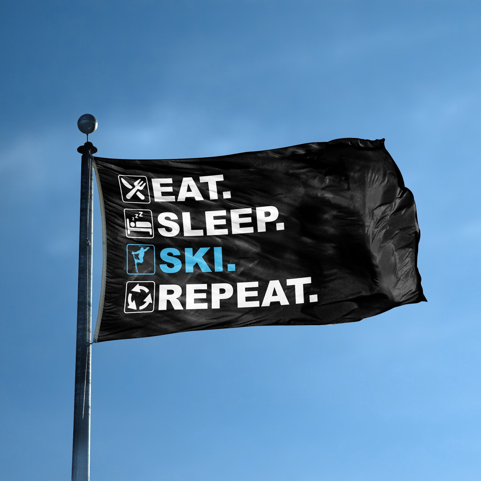 A flag with the saying "Eat Sleep Ski Repeat" displayed on a high pole, with a black, white and themed color scheme.