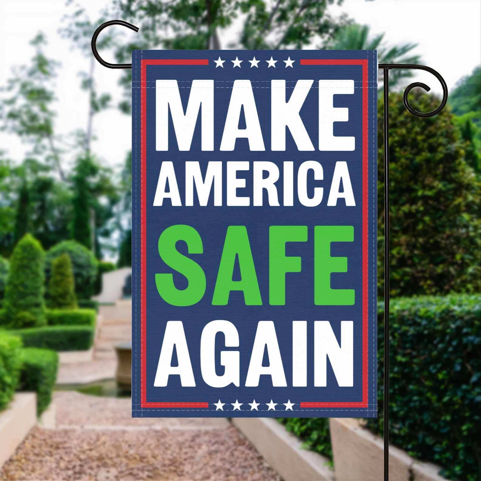 A red, white and blue political garden flag with the slogan Make America Safe Again.