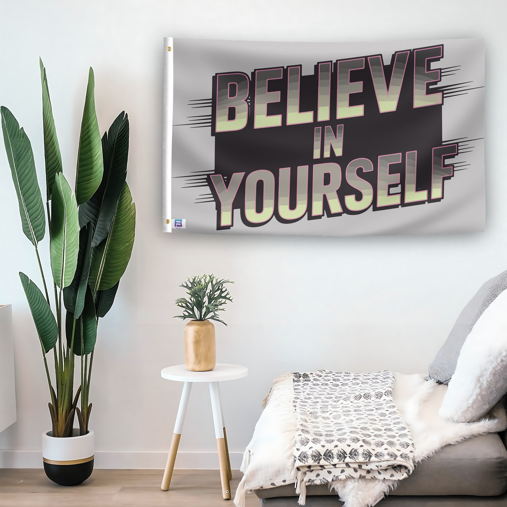 In a home setting, a flag with the saying "Believe In Yourself" is mounted on a white wall by a side table.