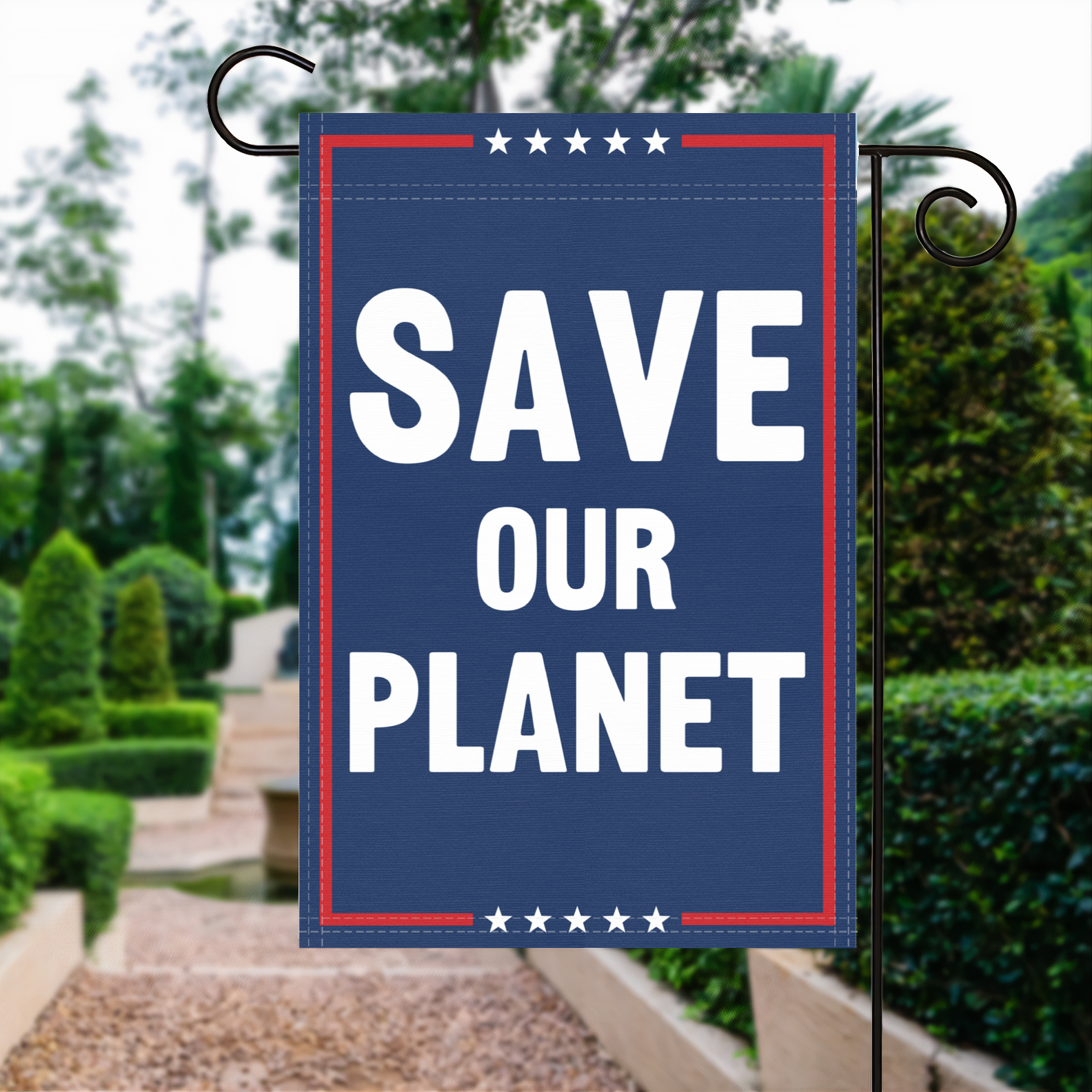 A red, white and blue political garden flag with the slogan Save Our Planet.