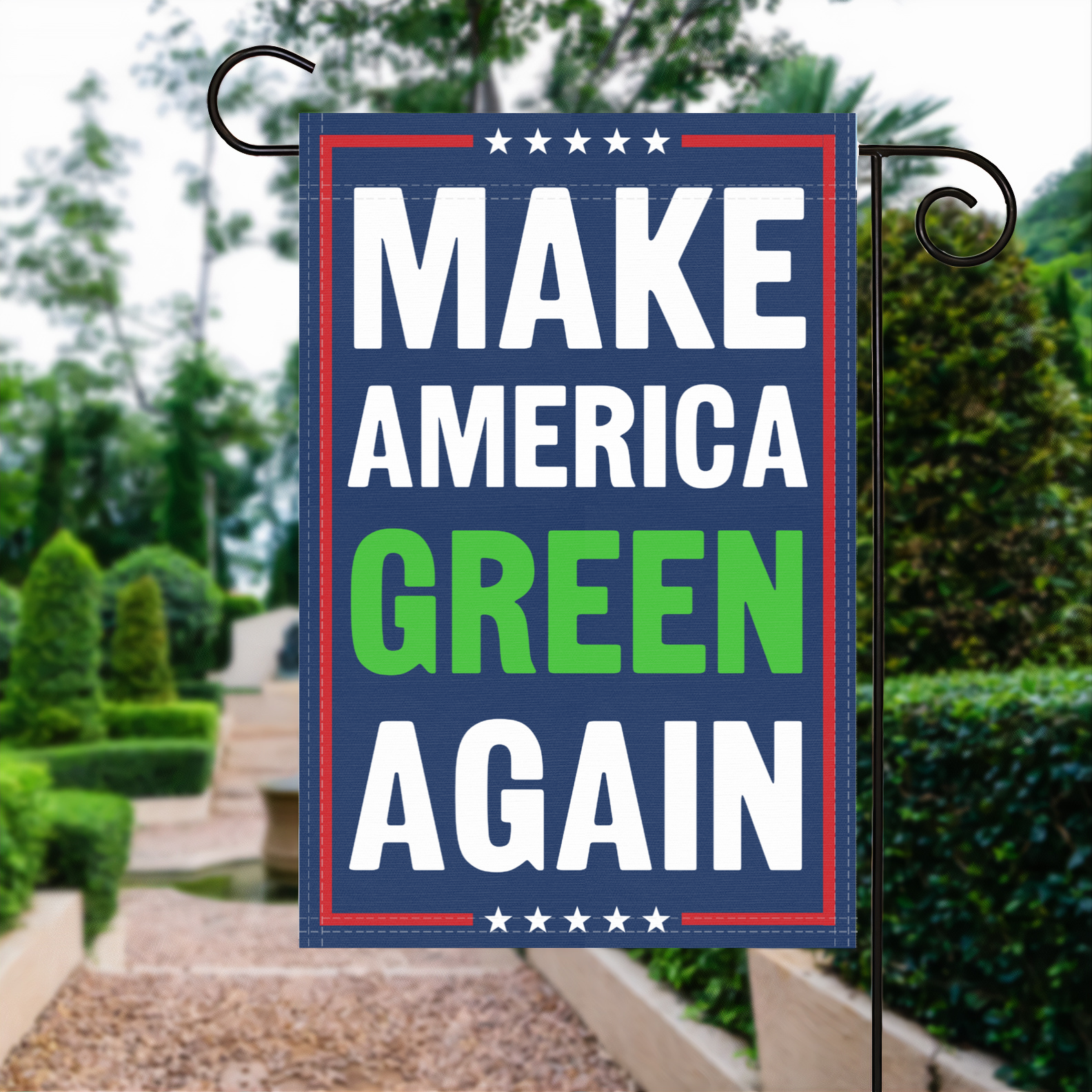 A red, white and blue political garden flag with the slogan Make America Green Again.