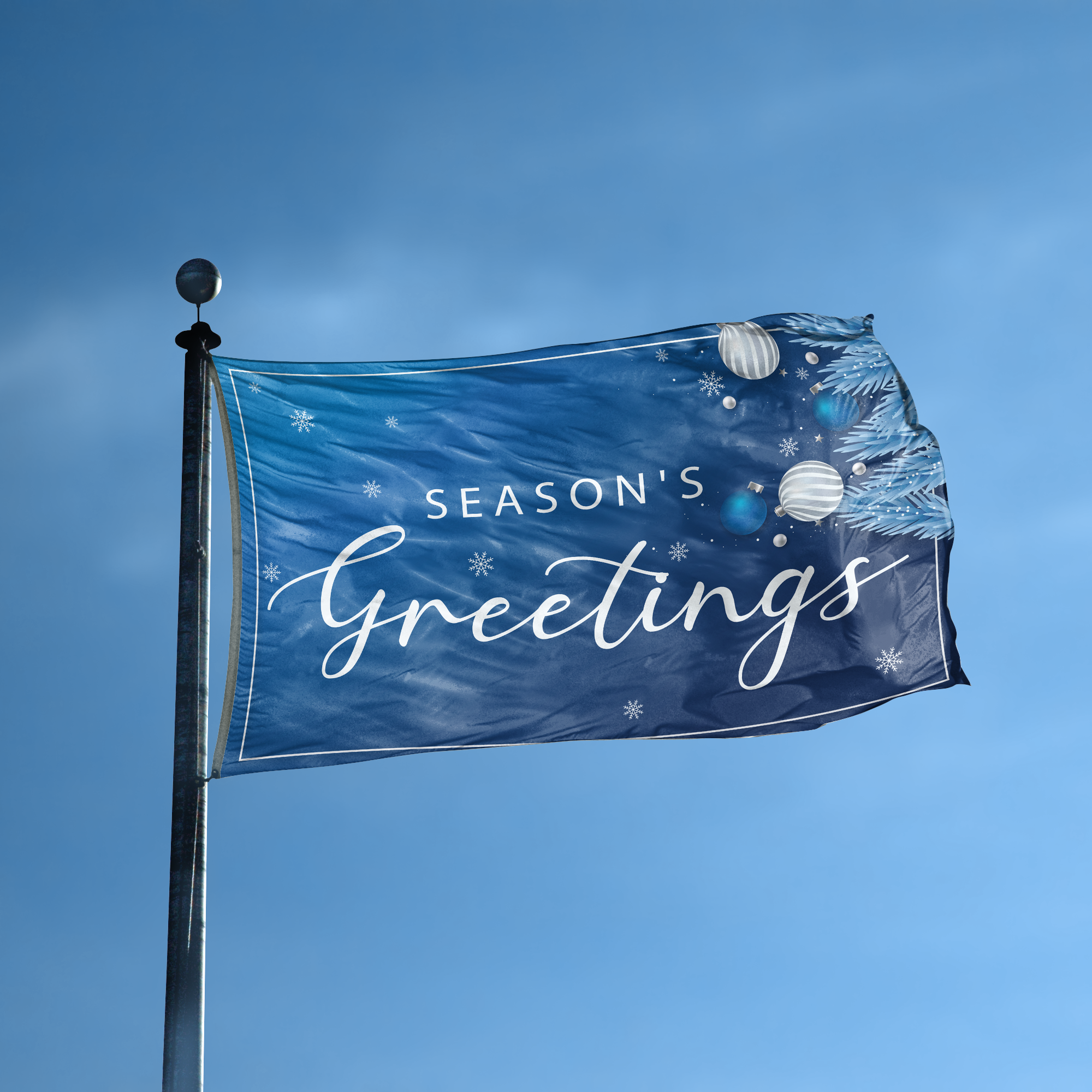 A flag with the saying "Season's Greetings" displayed on a high pole, with a holiday themed color scheme.