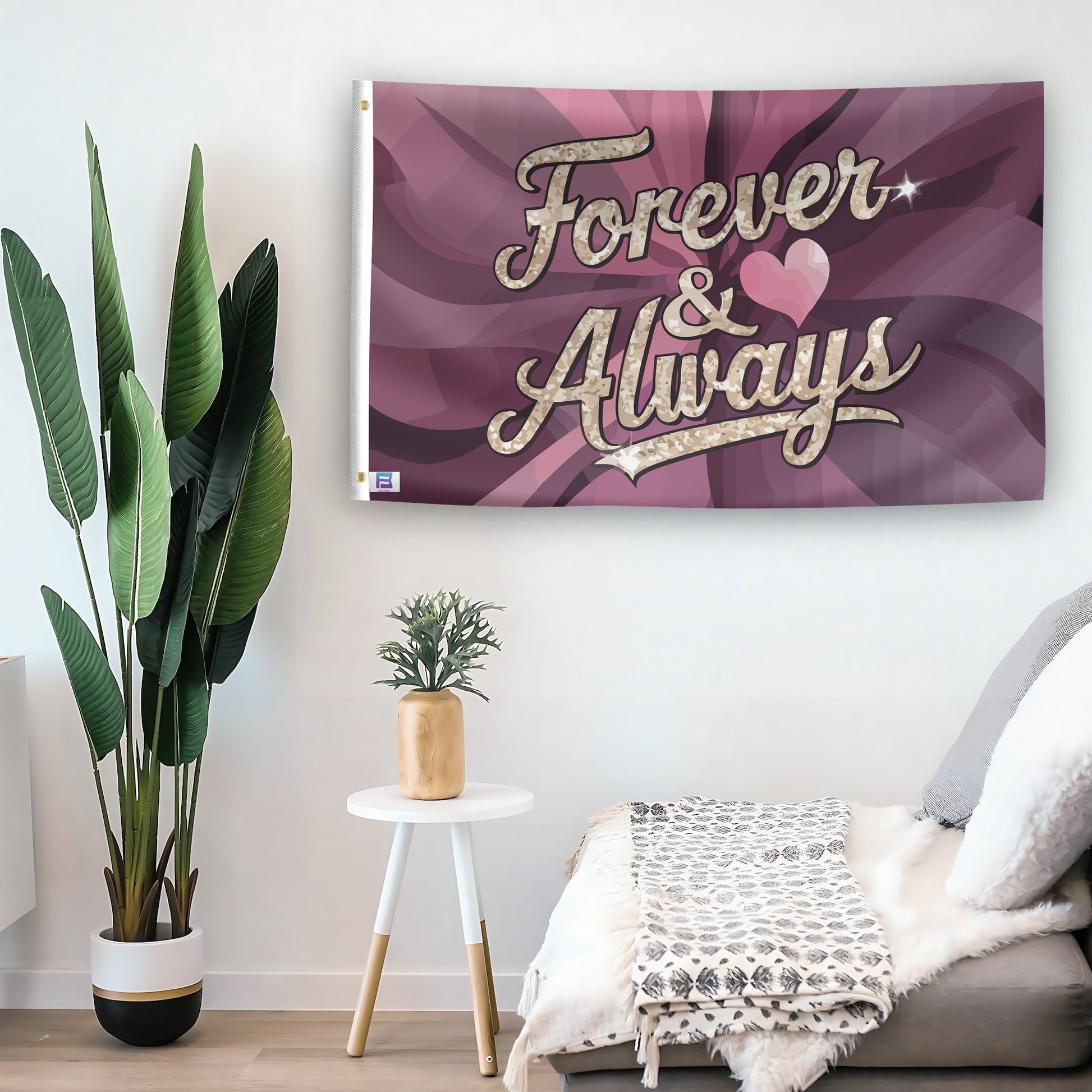 In a home setting, a flag with the saying "Forever & Always" is mounted on a white wall by a side table.