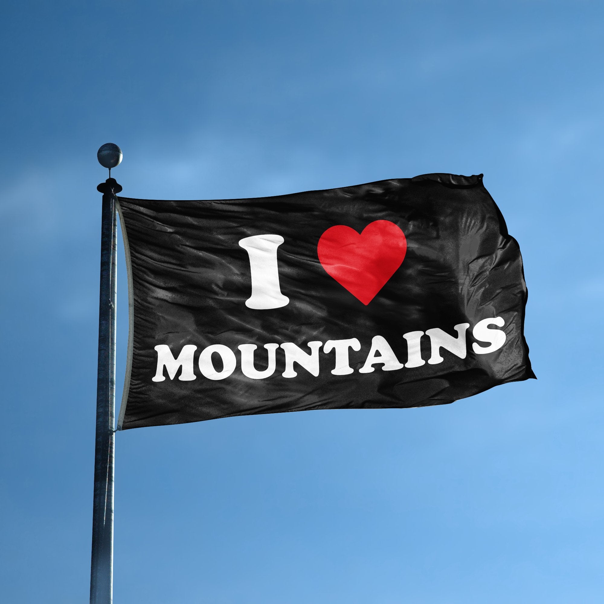 A flag with the saying "I Love Mountains" displayed on a high pole, with a black, white and red color scheme.