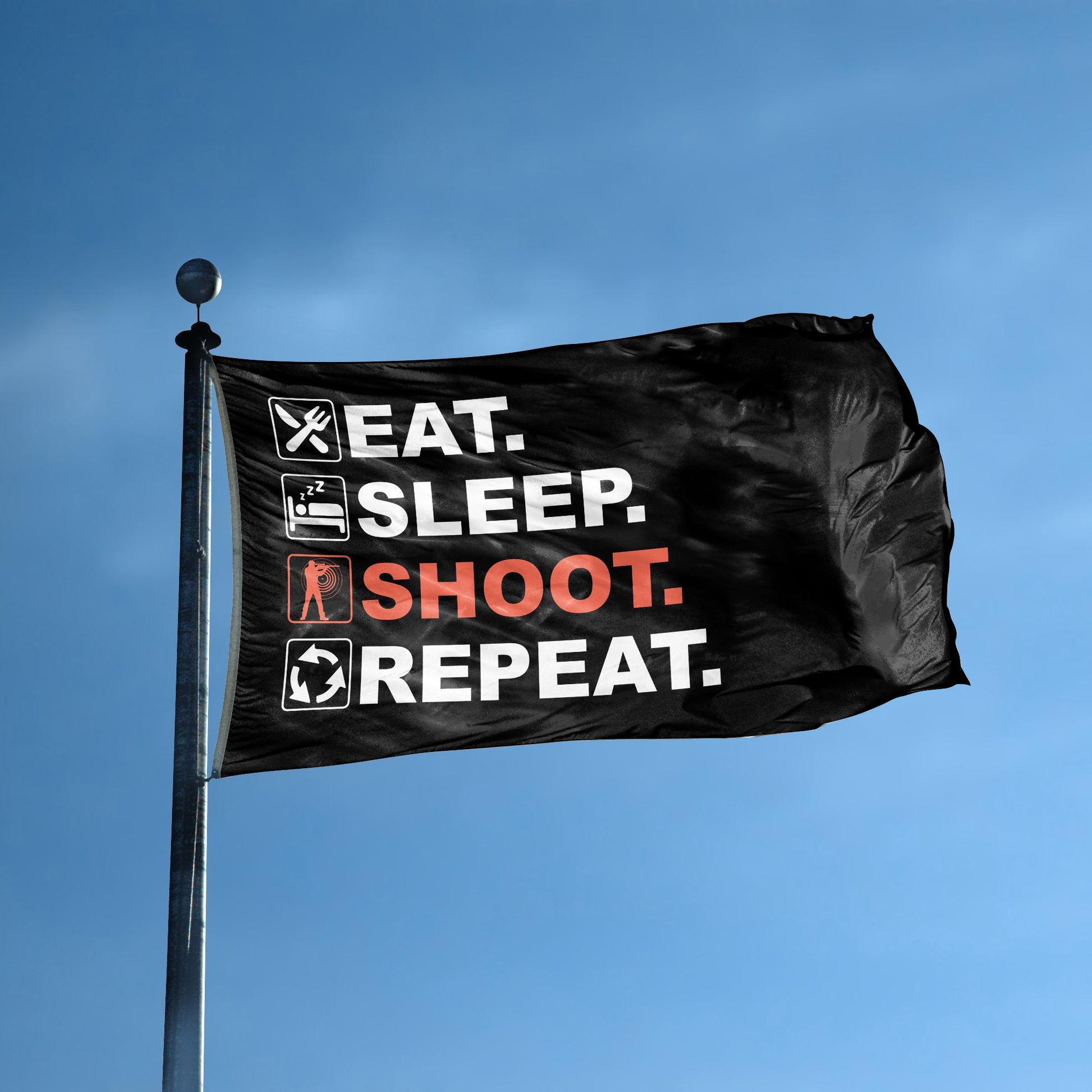 A flag with the saying "Eat Sleep Shoot Repeat" displayed on a high pole, with a black, white and themed color scheme.