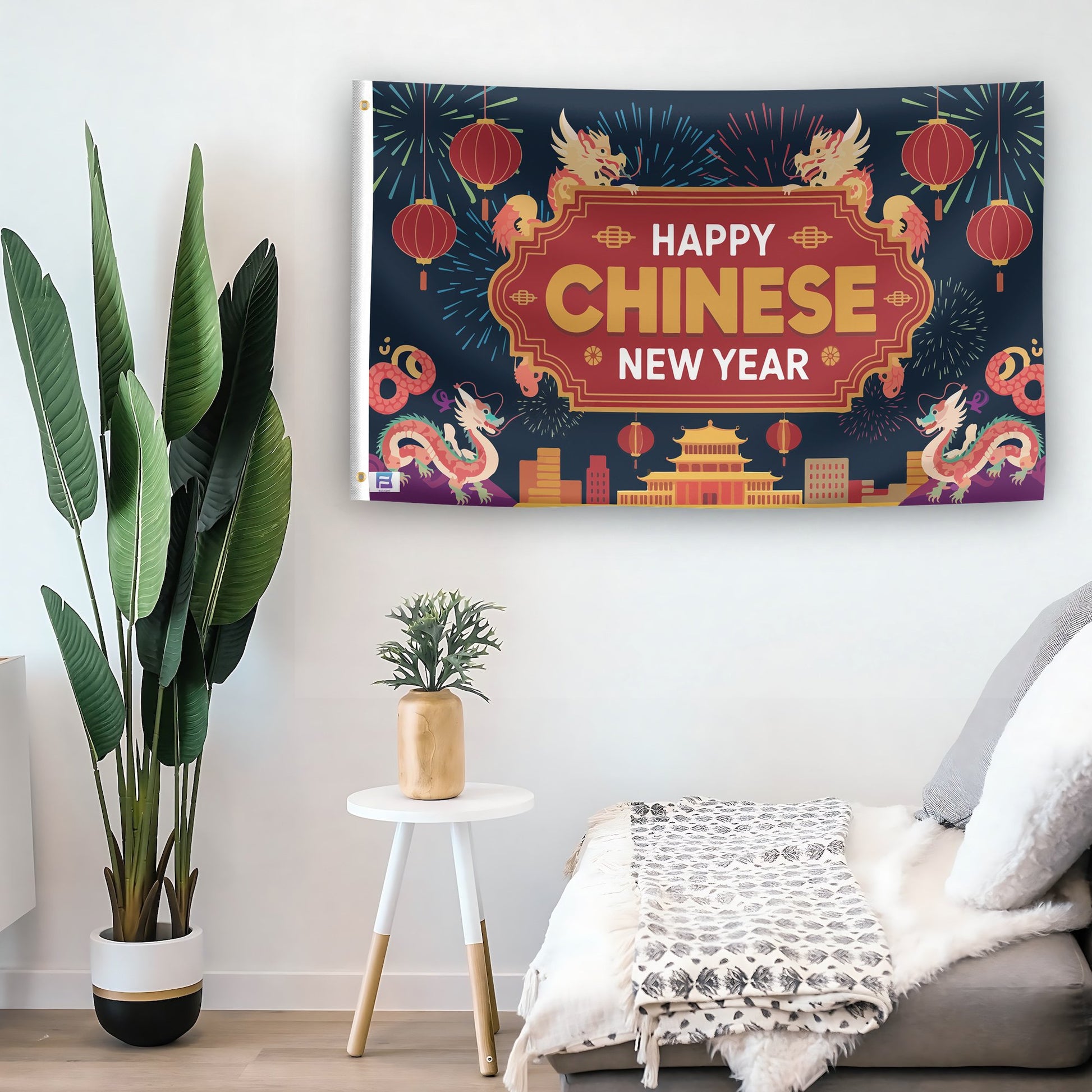 In a home setting, a flag with the saying "Happy Chinese New Year" is mounted on a white wall by a side table.