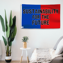 Load image into Gallery viewer, In a home setting, a blue and red flag with a political slogan is mounted on a white wall by a side table.
