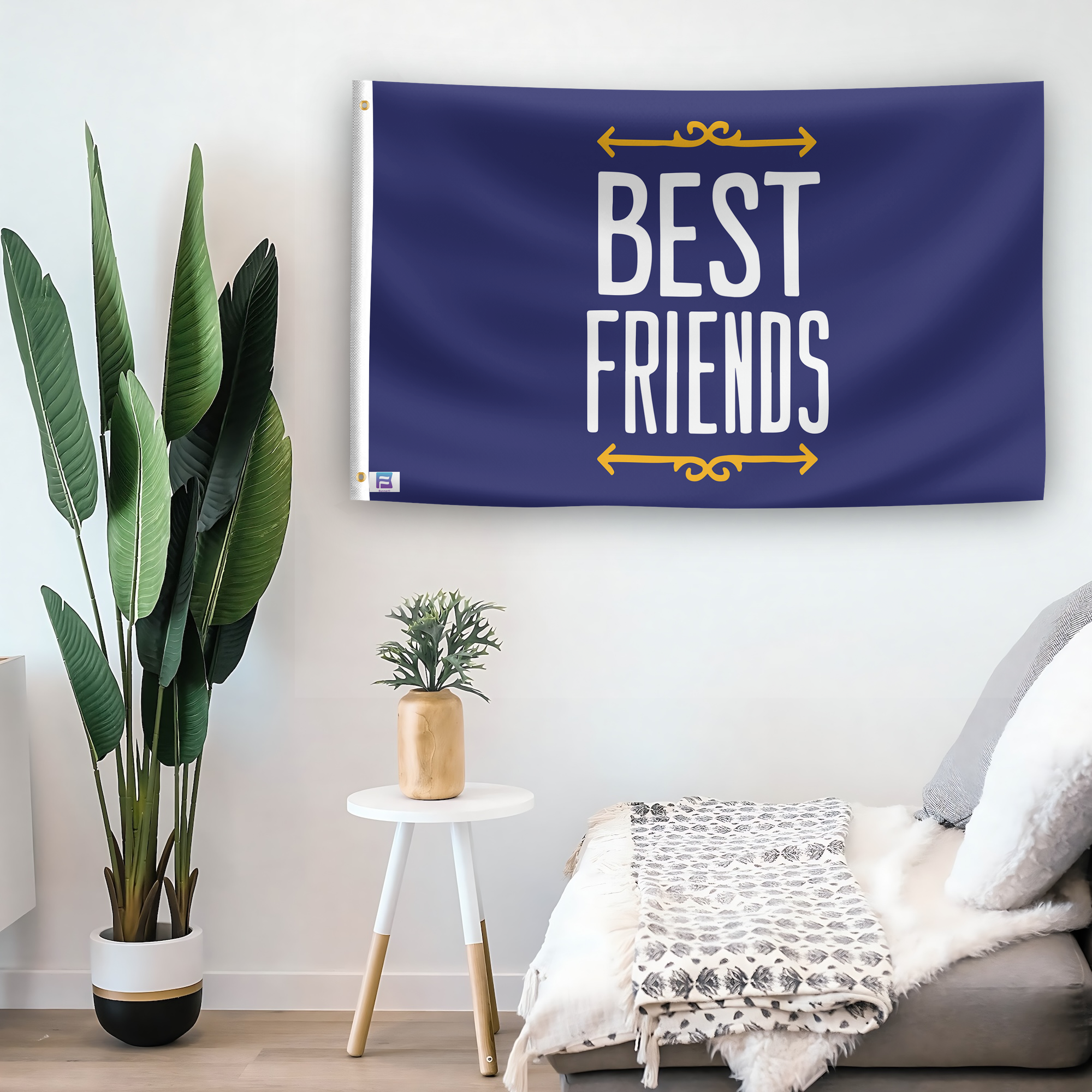 In a home setting, a flag with the saying "Best Friends" is mounted on a white wall by a side table.