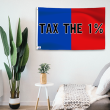 Load image into Gallery viewer, In a home setting, a blue and red flag with a political slogan is mounted on a white wall by a side table.
