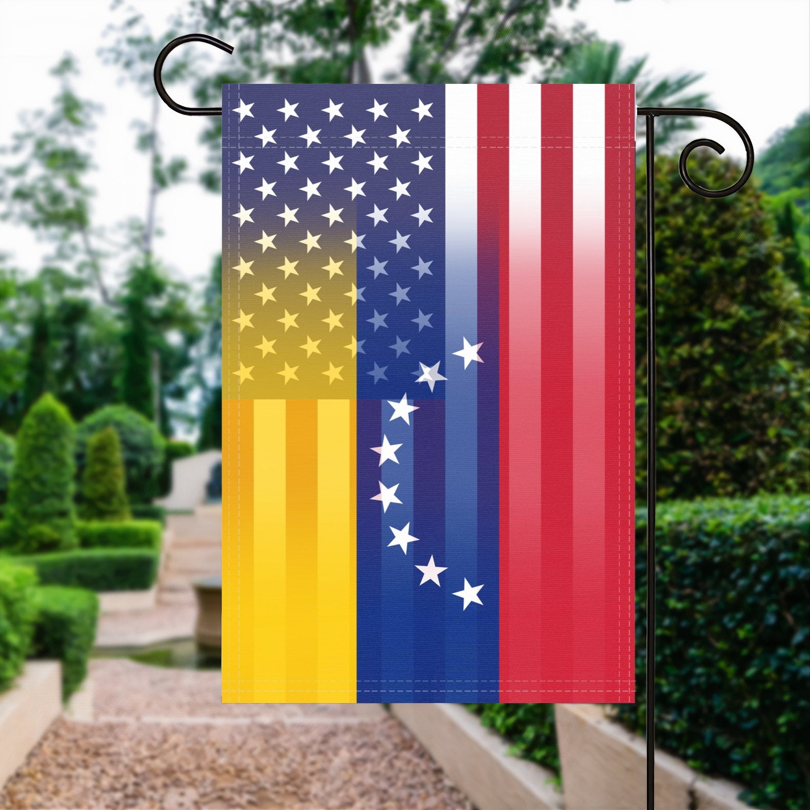 A garden flag with the Venezuelan American flag design seamlessly blended with the American flag, displayed in a garden.