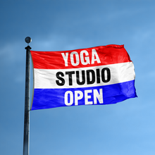 Load image into Gallery viewer, A business banner with the saying &quot;Yoga Studio Open&quot; displayed on a high pole, with a red, white, and blue color scheme.
