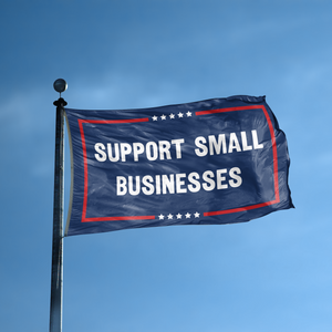 A flag with the saying "Support Small Businesses Political" displayed on a high pole, with a red, white, and blue color scheme.