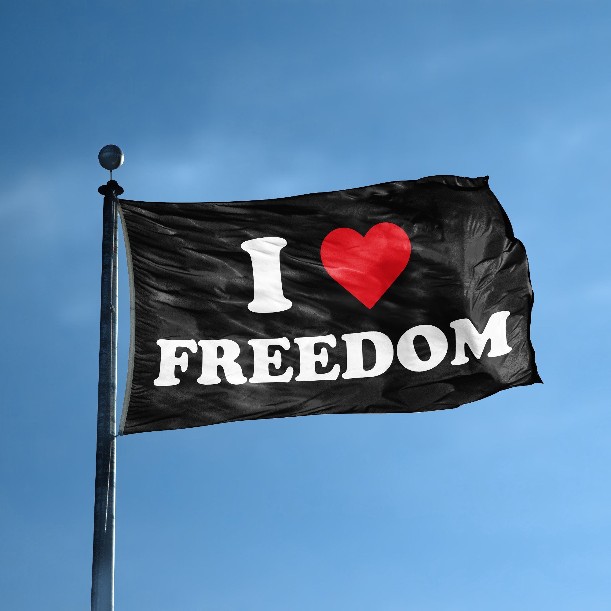 A flag with the saying "I Love Freedom" displayed on a high pole, with a black, white and red color scheme.