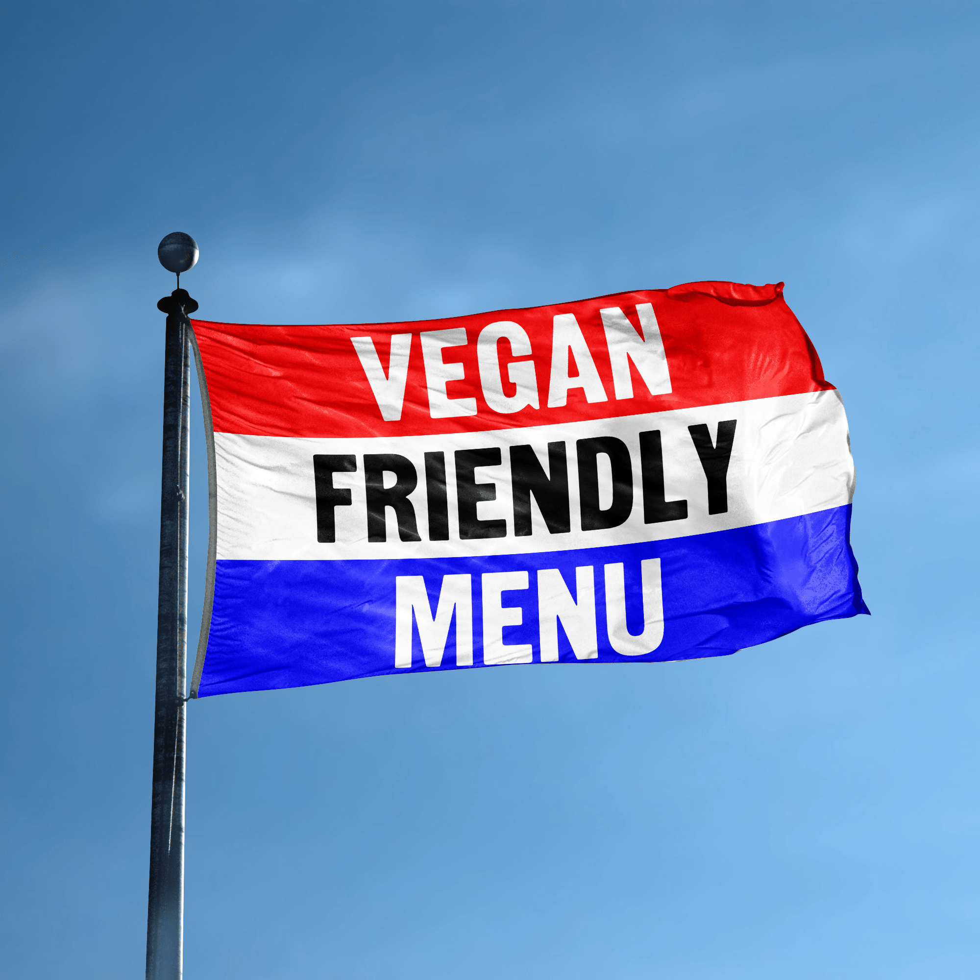 A business banner with the saying "Vegan Friendly Menu" displayed on a high pole, with a red, white, and blue color scheme.